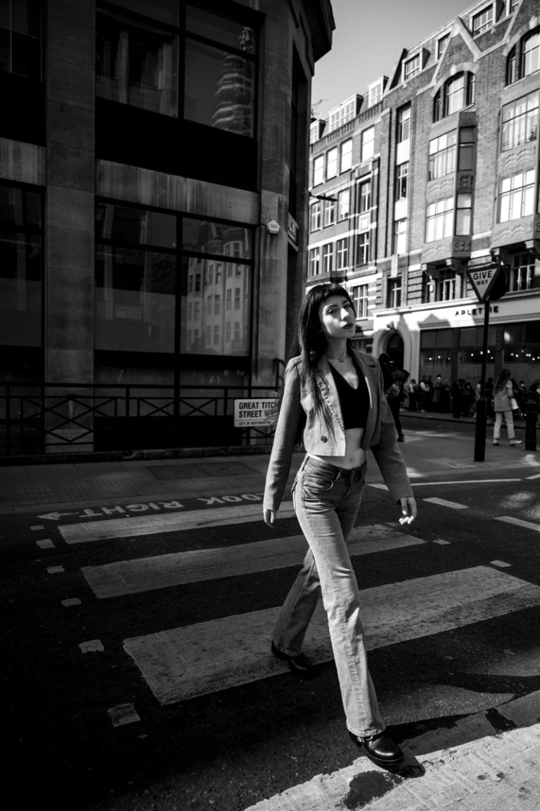 Edgy model walking on pedestrian crossing in the streets of London